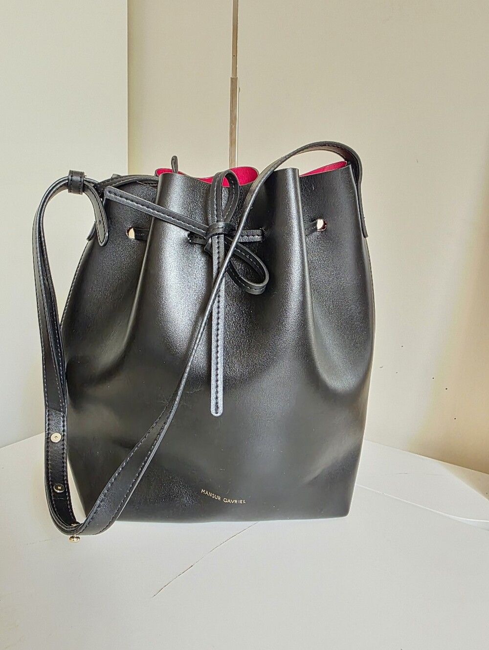 Mansur Gavriel Black Leather Drawstring Bucket Bag with Pink Liner. Size Large